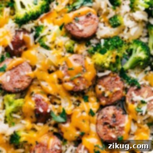 Creamy Cheesy Chicken, Broccoli, and Rice 3 Finished Cheesy Chicken, Broccoli, and Rice on a serving platter, topped with fresh parsley.
