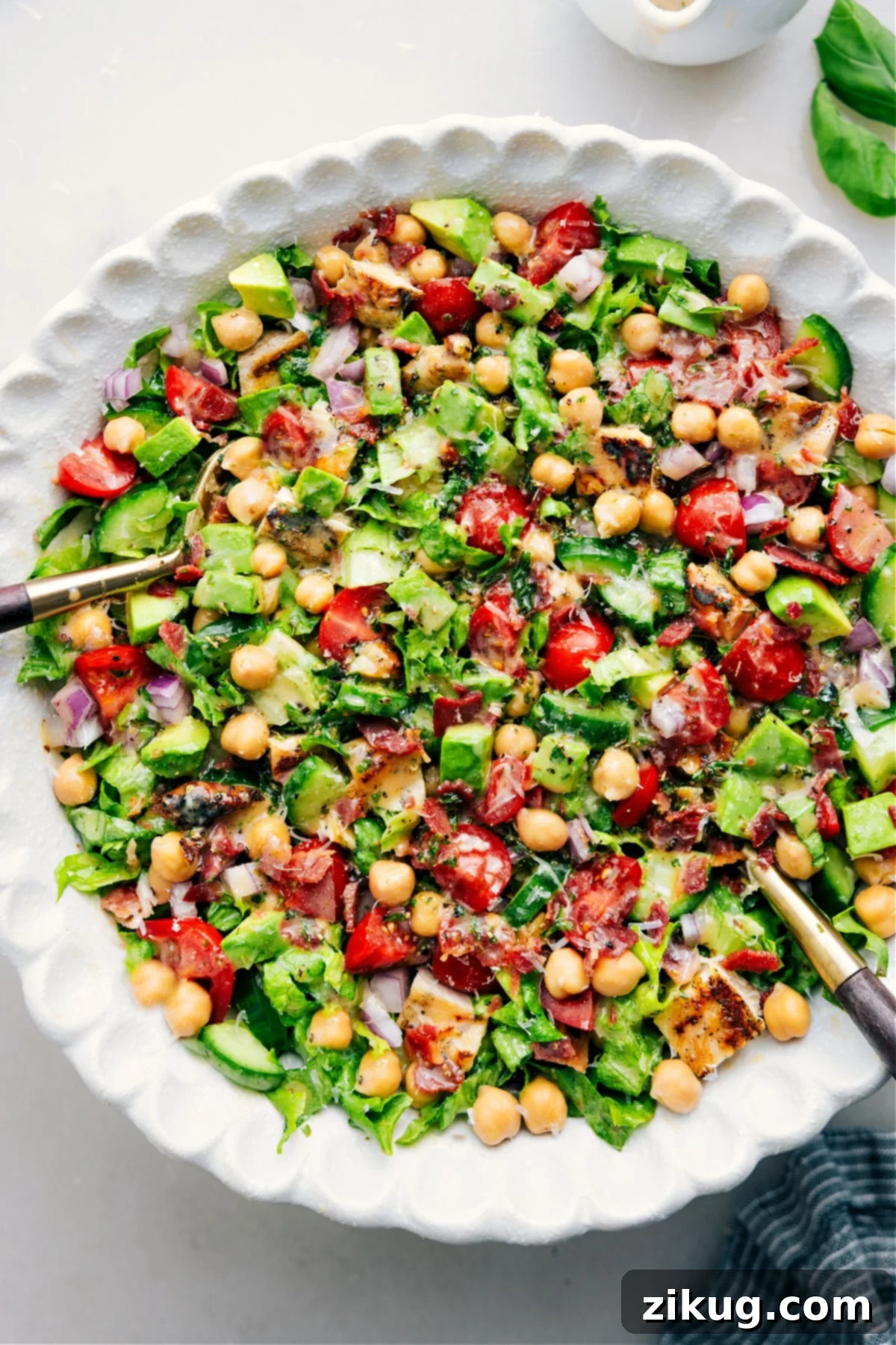 The Best Chopped Chicken Salad Chopped Chicken Salad mixed in a bowl with dressing.