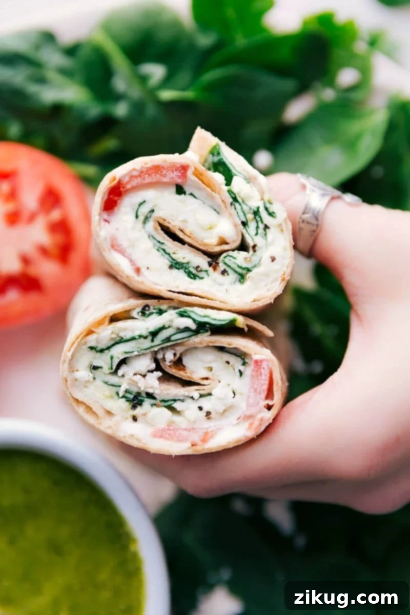 Cut egg wrap revealing its delicious filling inside both halves.