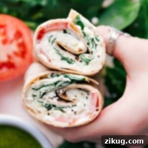 Cut egg wrap revealing its delicious filling inside both halves.