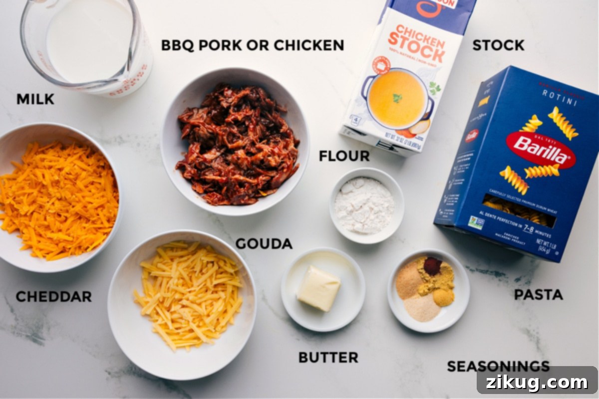 Ingredients prepped and ready for easy assembly: pork or chicken, milk, cheddar, gouda, flour, butter, seasonings, pasta, and stock.