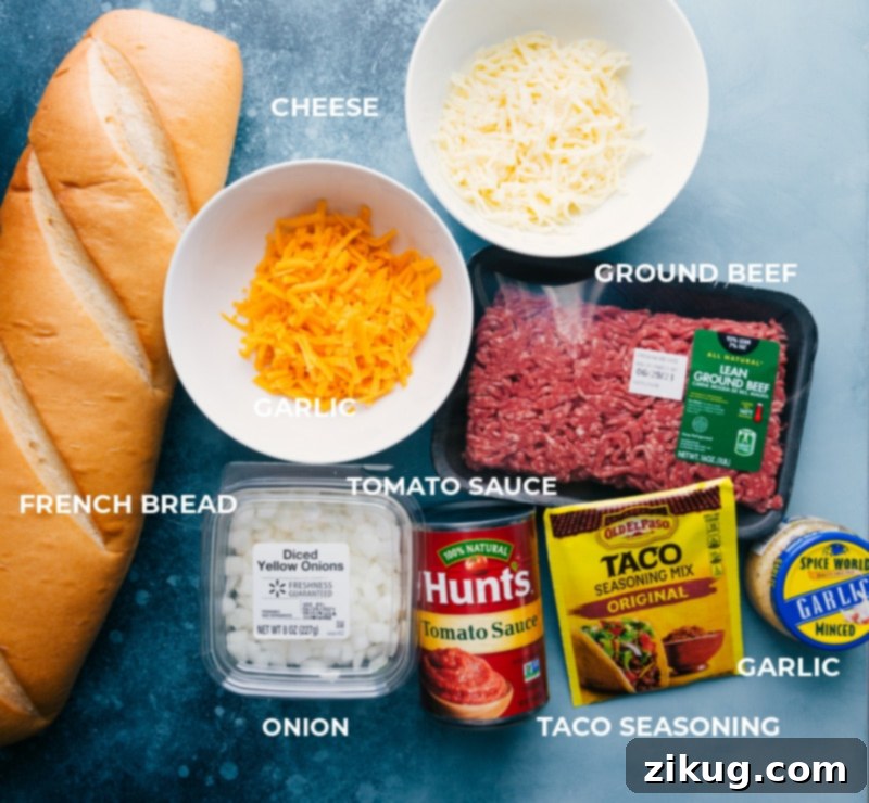 Gather your ingredients for this easy French Bread Taco Pizza recipe. All the fresh ingredients laid out for French Bread Taco Pizza.