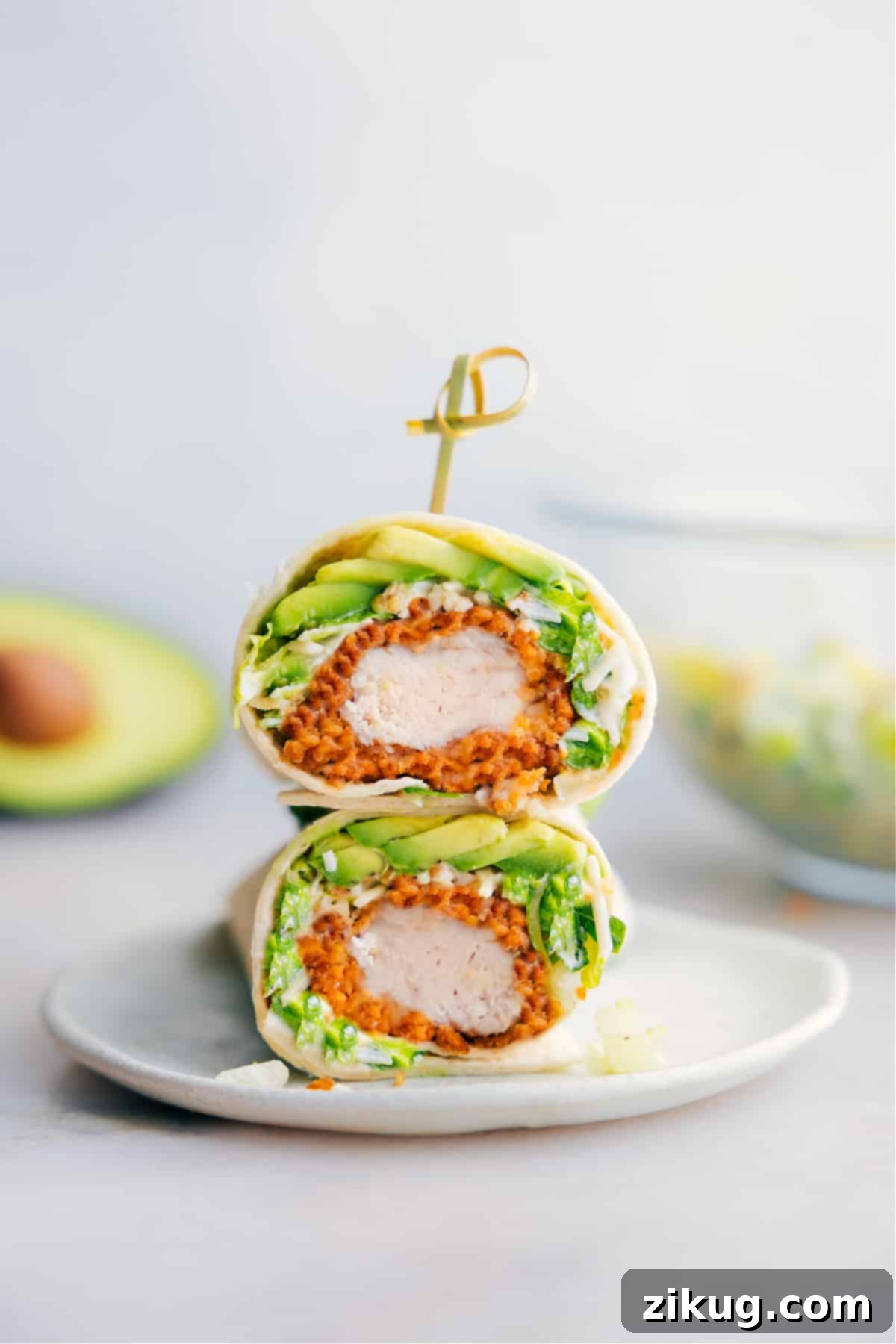 Chicken Caesar Wrap cut in half showing the insides of one of the wraps.