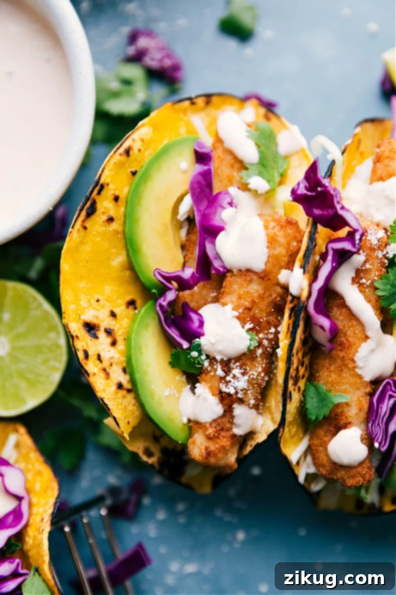 Up-close image of a Fish Stick Taco, showcasing the vibrant ingredients: a crispy fish stick, colorful slaw, creamy lime crema, and fresh cilantro, all within a warm corn tortilla.