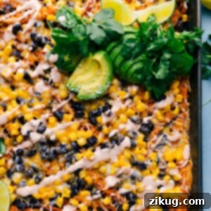 Finished Sweet Potato Nachos piled high with toppings, ready to eat.