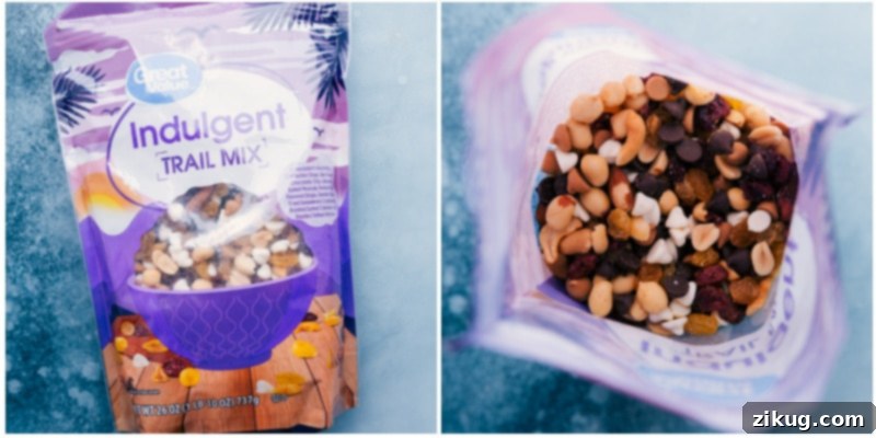 A close-up of the delicious and varied trail mix ingredients, showcasing nuts, dried fruits, and various chocolate chips.