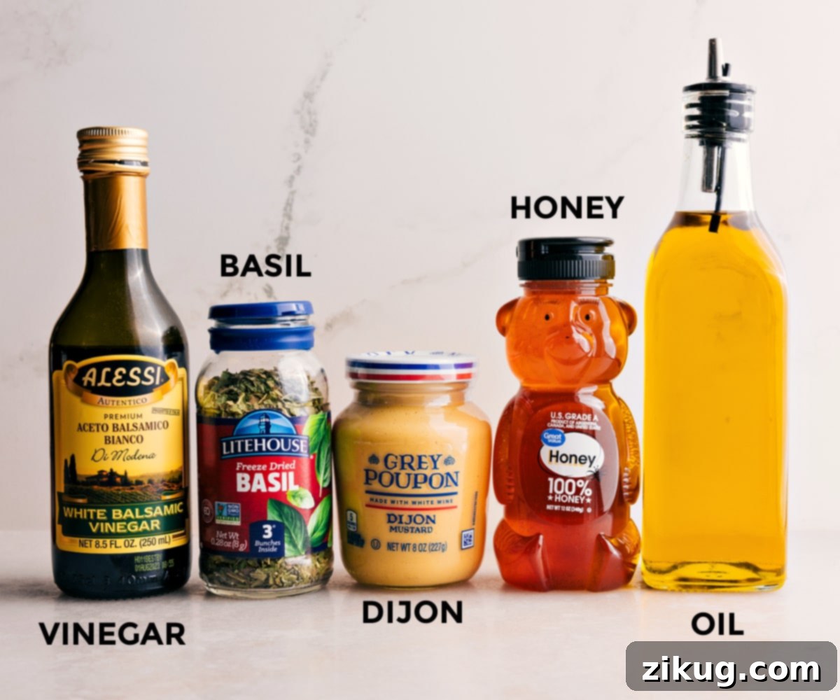 A collection of ingredients for the Summer Couscous Salad dressing: honey, olive oil, Dijon mustard, dried basil, and white balsamic vinegar, ready to be combined.