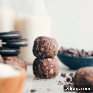 Cookies and Cream Power Bites 2 Cookies & Cream Energy Bites stacked on top of each other, ready to be enjoyed.