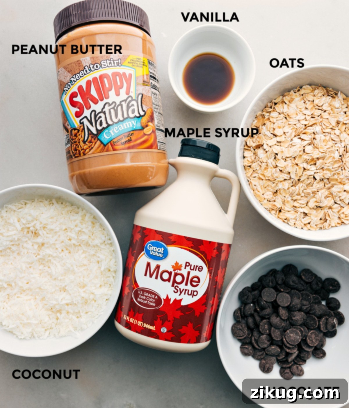 Key Ingredients for Healthy Cookies And Cream Energy Bites All the wholesome ingredients for Cookies And Cream Energy Bites, including peanut butter, vanilla, oats, maple syrup, coconut, and dark chocolate chips, are beautifully prepped for effortless mixing.