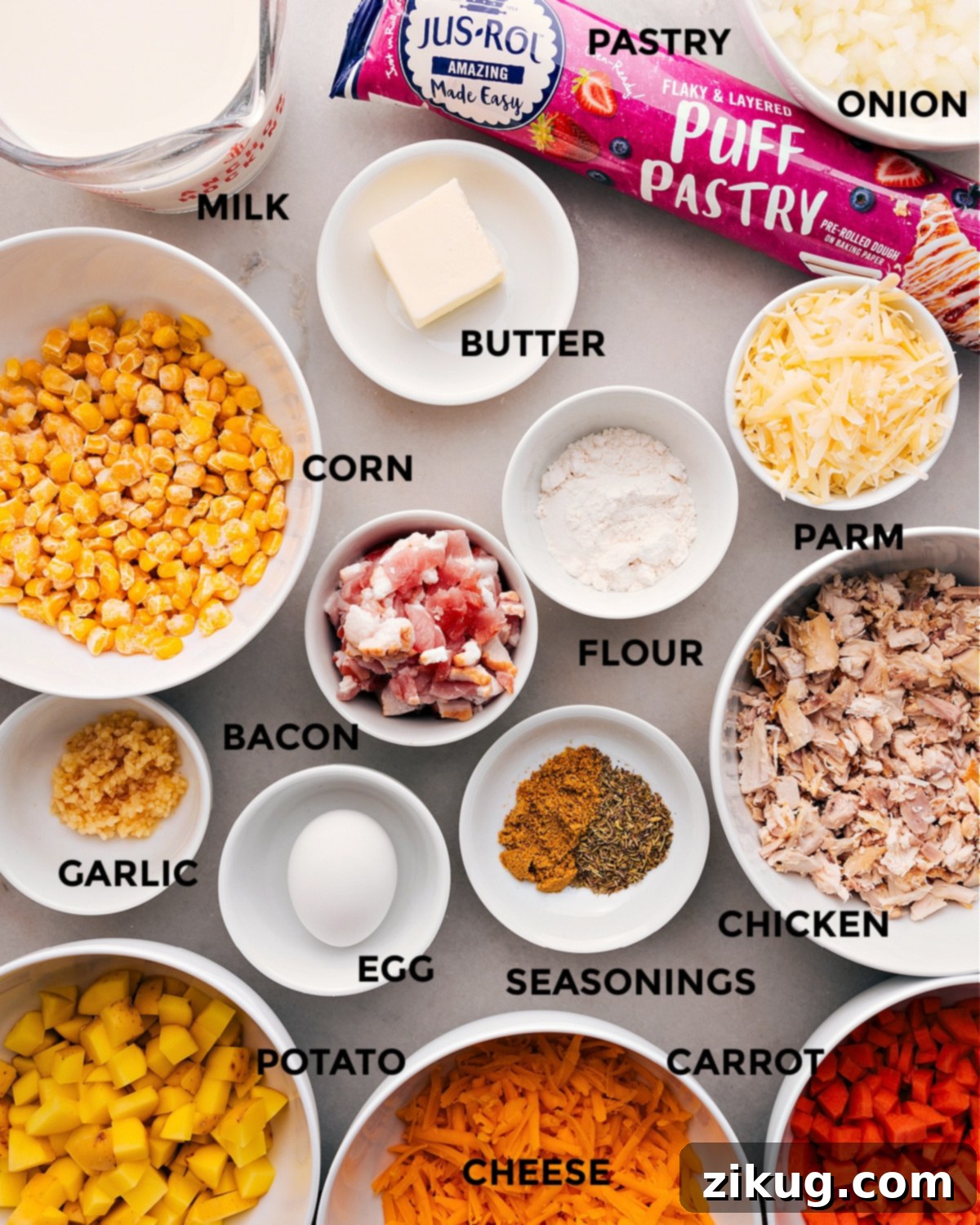Ingredients In Corn Chowder Pot Pie All the fresh ingredients like diced onions, carrots, and potatoes, along with chicken, bacon, and cheese, are neatly prepped and arranged for easy assembly of the Corn Chowder Pot Pie.