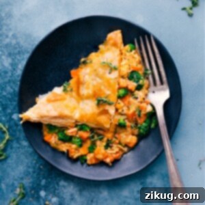 A delicious slice of Broccoli Cheddar Pot Pie with a flaky crust