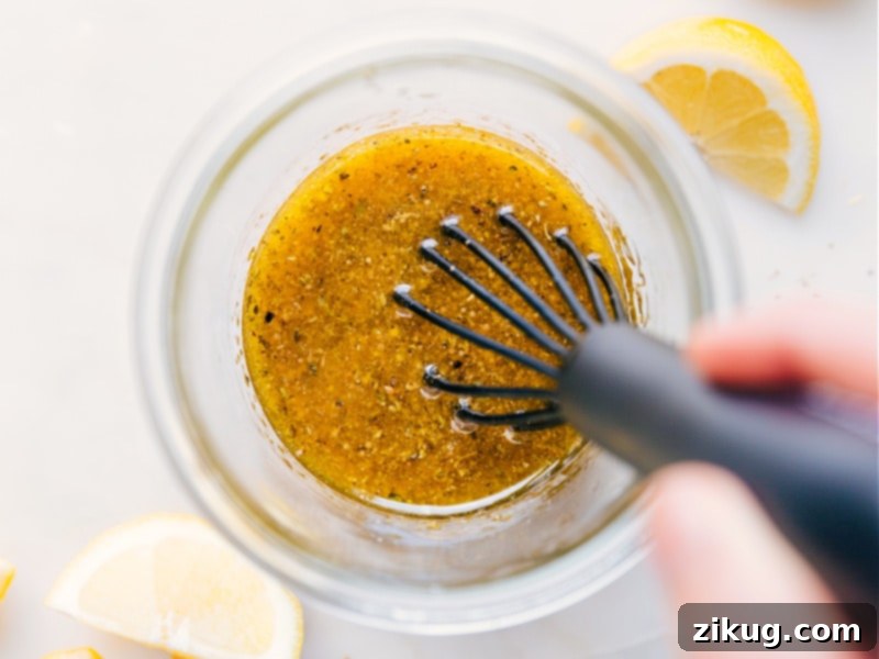 Image of Greek Salad Dressing mixed and ready to be poured over a fresh salad