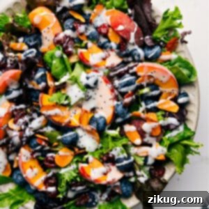 A close-up of homemade Poppyseed Salad Dressing in a rustic jar, ready to be served.