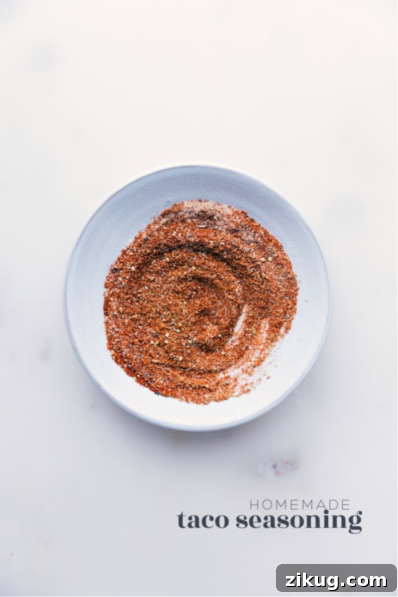 Our favorite homemade Taco Seasoning blend is so simple to make and uses spices you probably already have in your cabinet! Ditch those store-bought packets--you'll never want to use them again after seeing how easy and tasty making your own Taco Seasoning can be! Homemade Taco Seasoning blend in a small bowl, ready to use