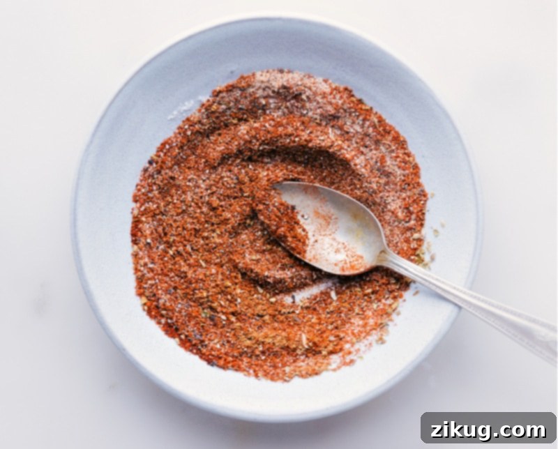 Our favorite Homemade Taco Seasoning blend, perfectly mixed and ready to infuse flavor into your next meal! Overhead shot of freshly mixed homemade taco seasoning in a bowl
