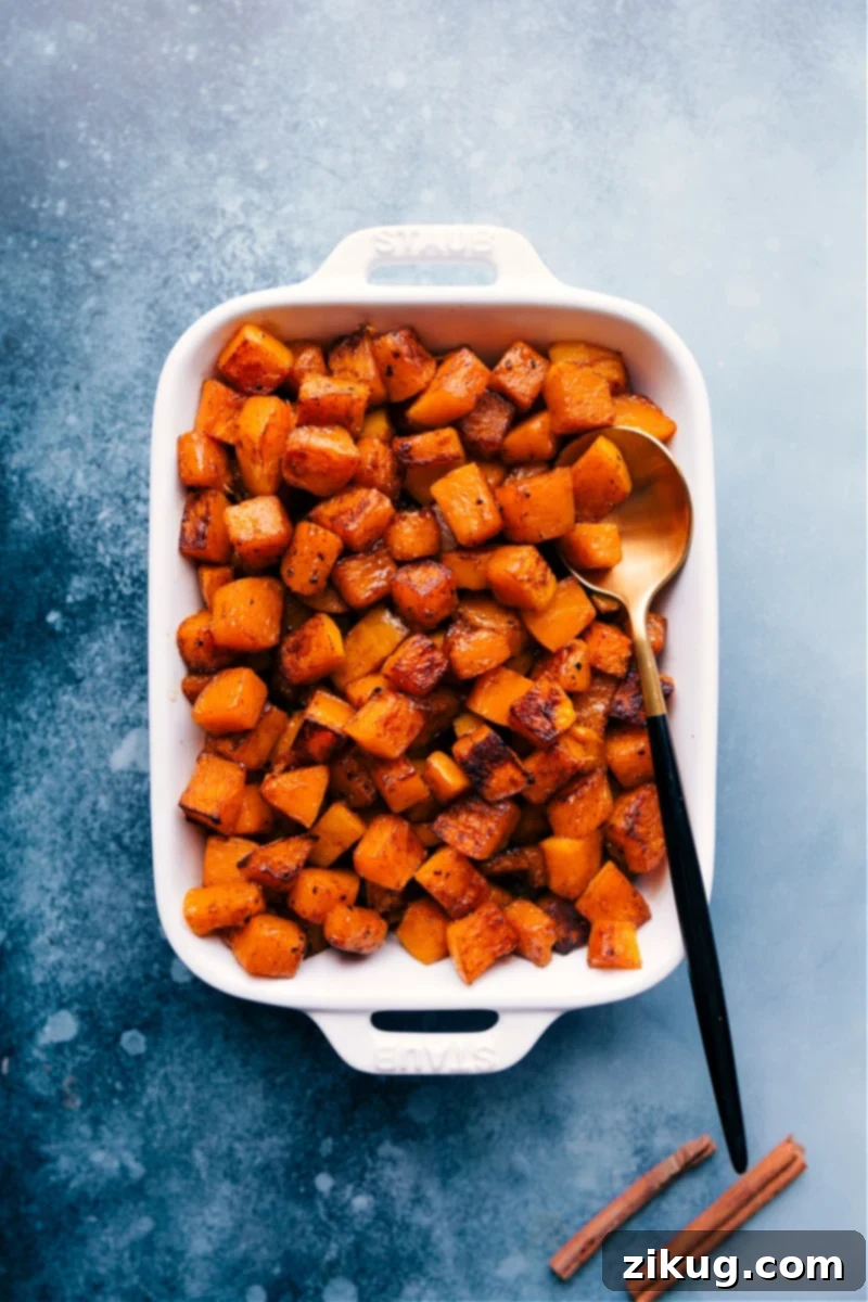 Perfectly Roasted Butternut Squash: Caramelized and Sweet Overhead image of beautifully roasted butternut squash cubes in a pan, perfectly caramelized and ready to serve.