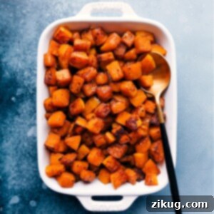 Close-up of golden-brown roasted butternut squash pieces, perfectly caramelized.