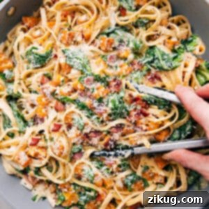 Butternut Squash Pasta served in a large pot, garnished with Parmesan and fresh thyme.