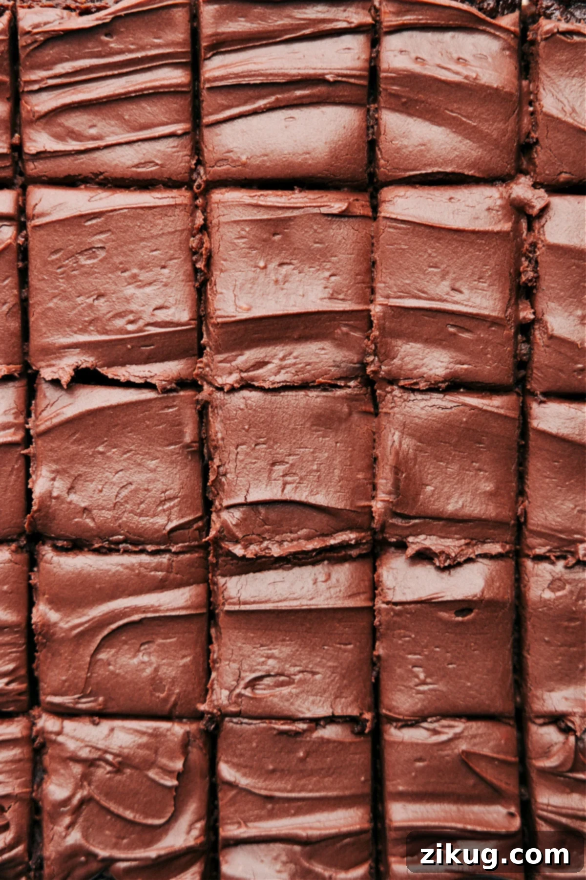 Beautifully frosted healthy brownies, perfectly cut into uniform squares and arranged invitingly, ready to be served as a wholesome and delicious dessert.