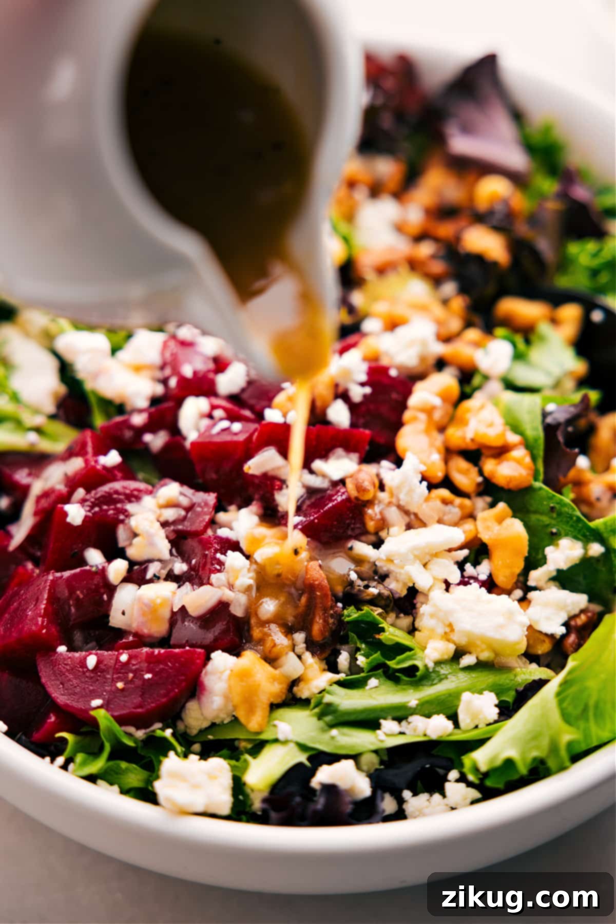 How to Dress Your Beet Goat Cheese Walnut Salad Perfectly Dressing the freshly prepared beet goat cheese walnut salad with the delicious homemade honey-Dijon dressing.