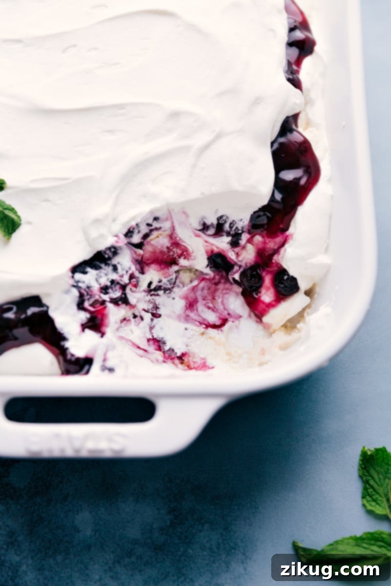 Delicious layered Blueberry Trifle with angel food cake, blueberry filling, and whipped cream. Blueberries and Cream Cake Trifle