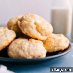 Close-up of freshly baked golden drop biscuits on a cooling rack