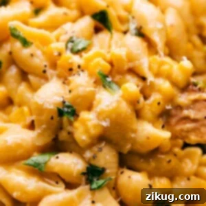 A vibrant bowl of creamy corn pasta with fresh basil, ready to be served.