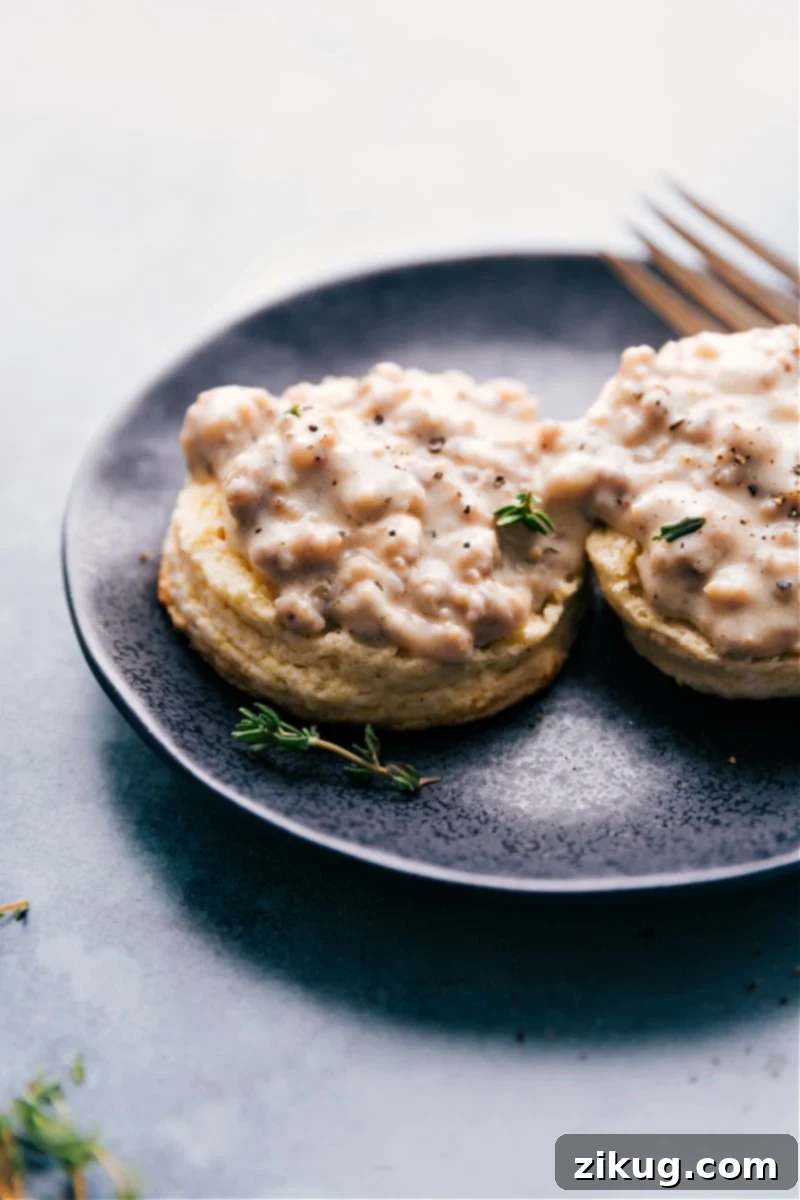 Classic Biscuits and Gravy dish with golden biscuits and creamy sausage gravy.