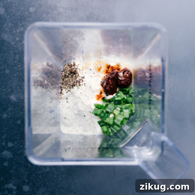 Overhead image showing all the ingredients for Chipotle Ranch Dip in a blender, ready for blending