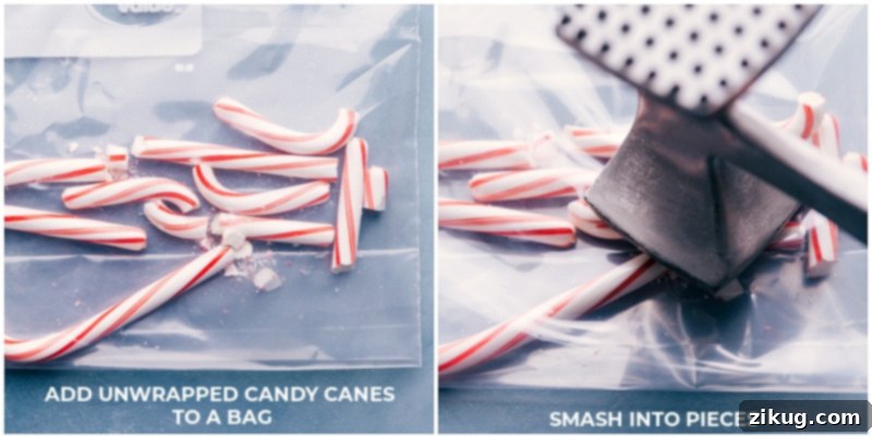 The first step: perfectly crushing peppermint candy canes for the ultimate holiday bark. Close-up process shot of unwrapped candy canes being crushed inside a double-layered plastic bag with a rolling pin.