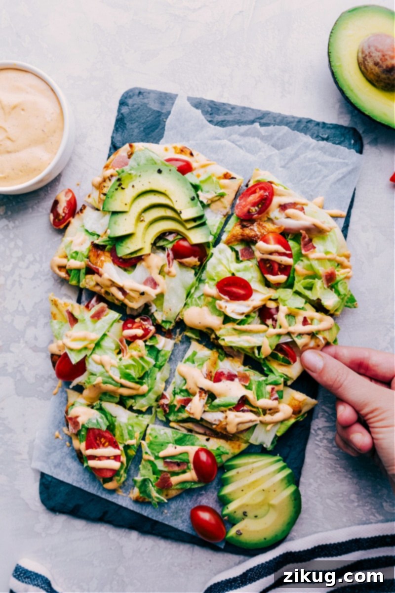 Chipotle Chicken Flatbread Slices Ready to Serve Slices of Chipotle Chicken Flatbread arranged on a serving plate, ready to be enjoyed.