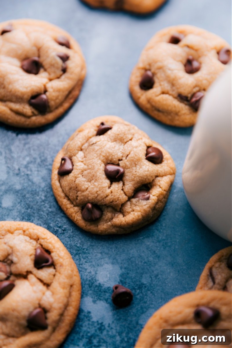 The ultimate stack of thick, soft, and chewy Peanut Butter Chocolate Chip Cookies – pure indulgence in every bite Image of the stacked Peanut Butter Chocolate Chip Cookies, showcasing their irresistible thickness, softness, and chewiness with abundant chocolate chips