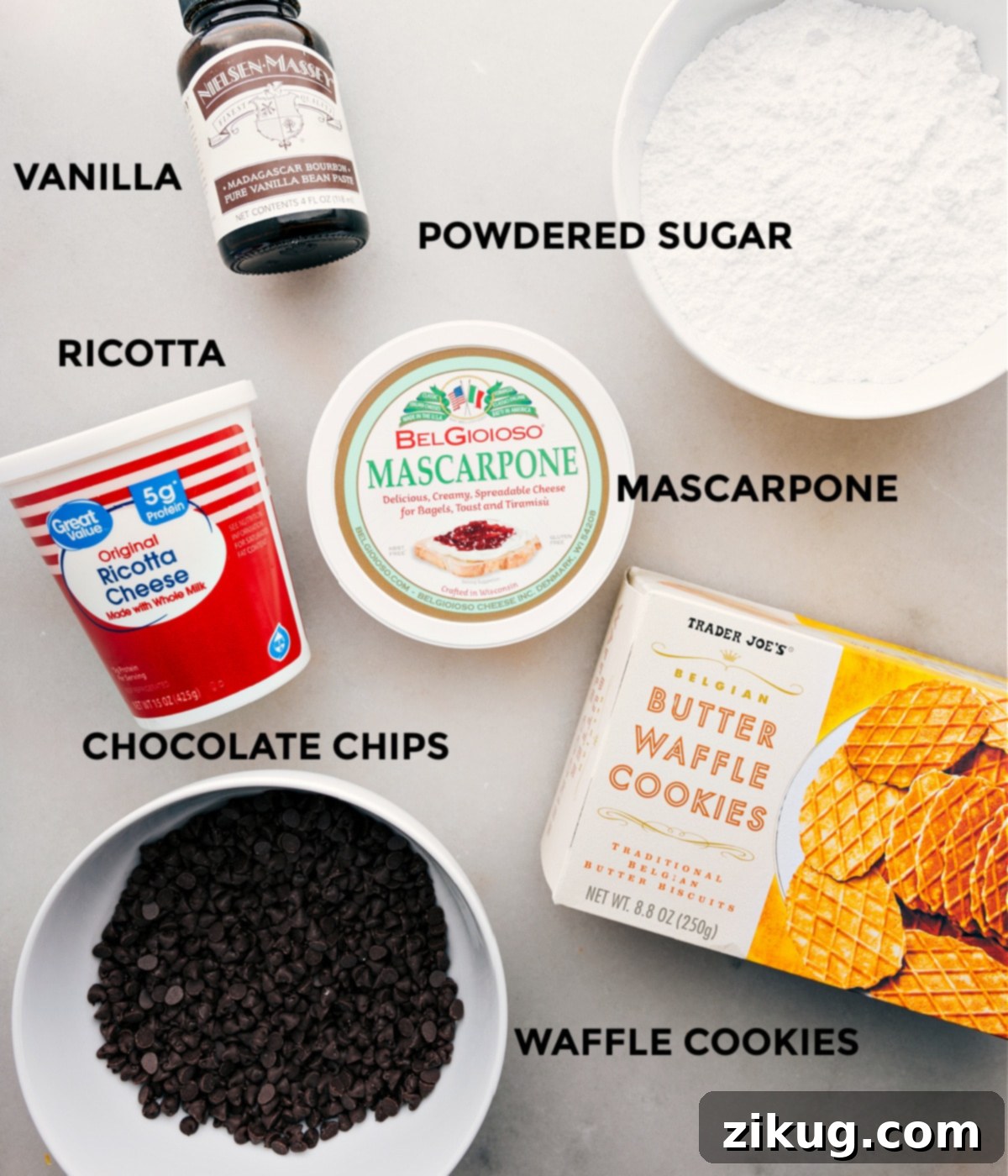 Ingredients In The Best Cannoli Dip Recipe All the ingredients in this recipe including mascarpone, ricotta, powdered sugar, vanilla, and chocolate chips prepped out for easy assembly.