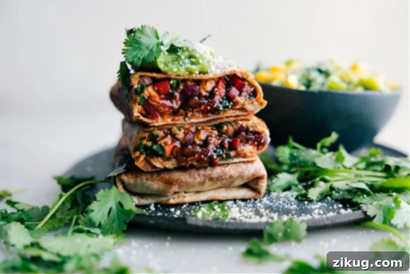 Enjoy the perfectly stacked and ready-to-eat BBQ Chicken Wraps. A visually appealing stack of finished BBQ Chicken Wraps, garnished and ready for serving.
