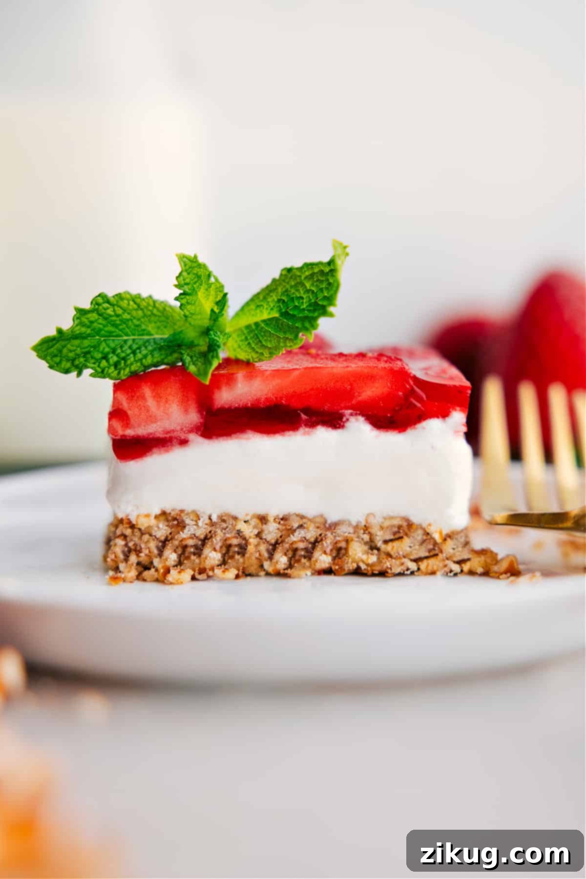 Strawberry Pretzel Salad Strawberry Pretzel Salad on a plate ready to be enjoyed.