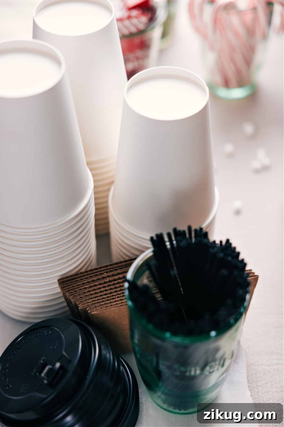 Coordinated Coffee Cups Assorted coffee cups with matching lids arranged neatly.