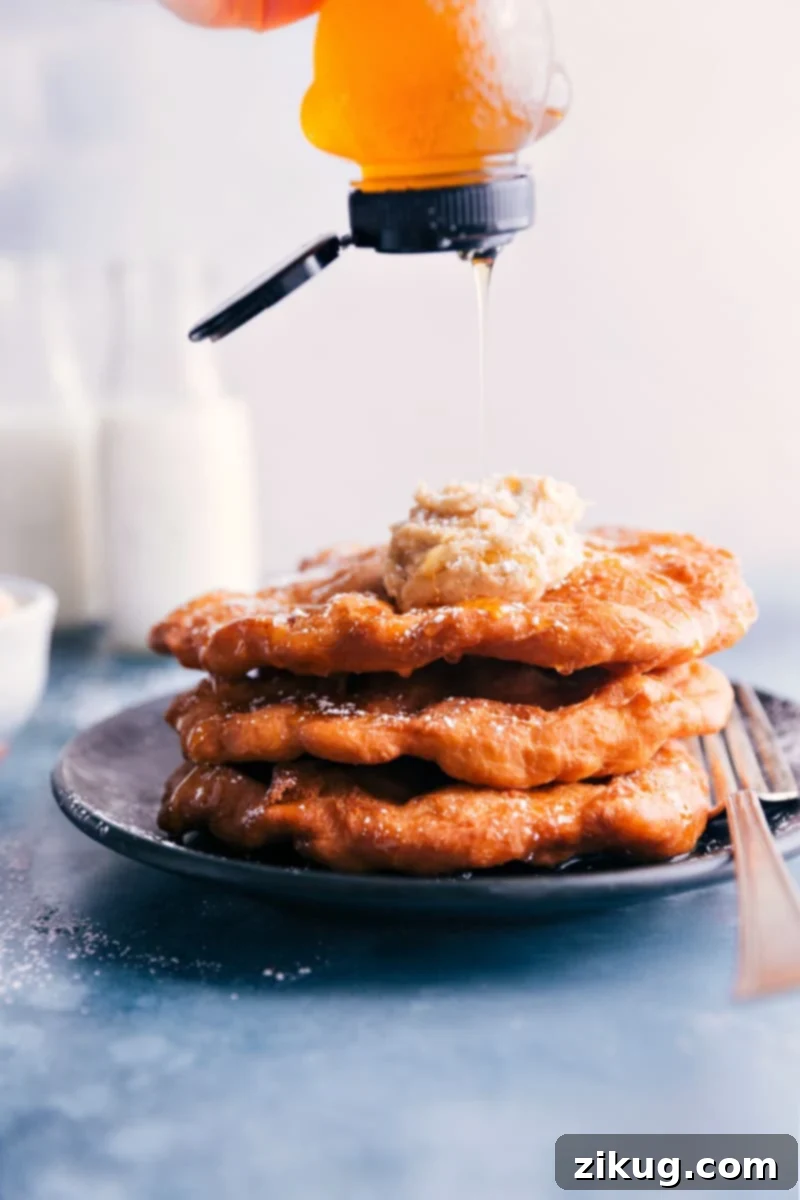 Image of honey being drizzled on freshly fried Utah Scones, a signature sweet topping