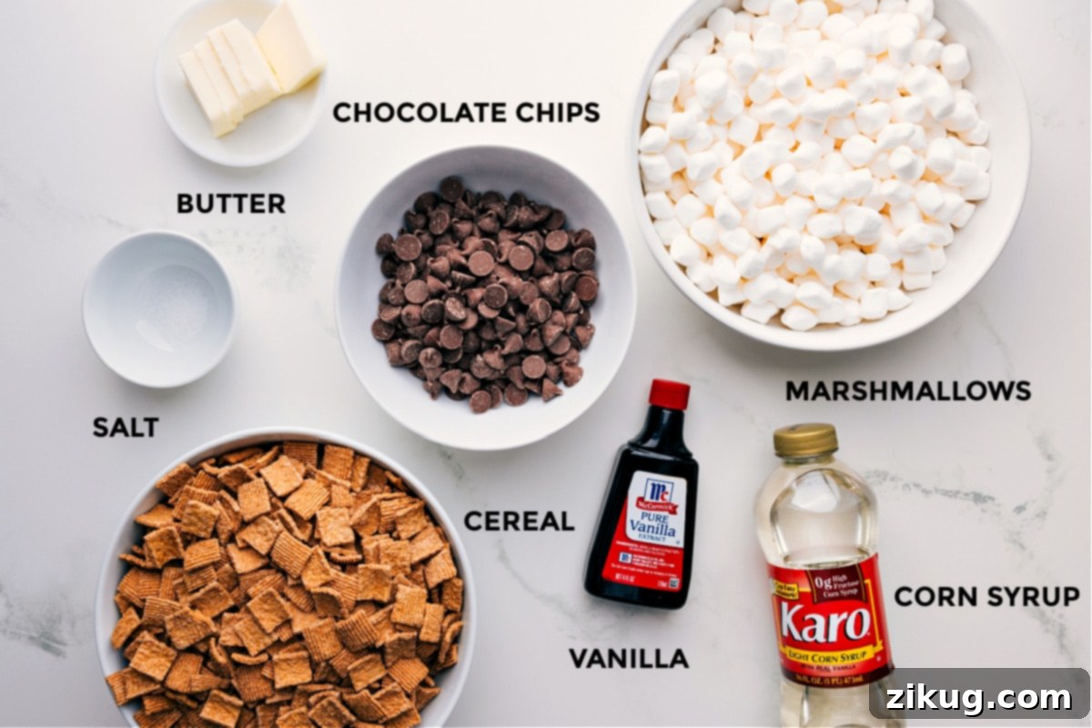 Key Ingredients for Homemade S'mores Cereal Bars All the essential ingredients for making S'mores Cereal Bars, including butter cubes, milk chocolate chips, miniature marshmallows, light corn syrup, vanilla extract, and Golden Grahams cereal, neatly arranged for preparation.