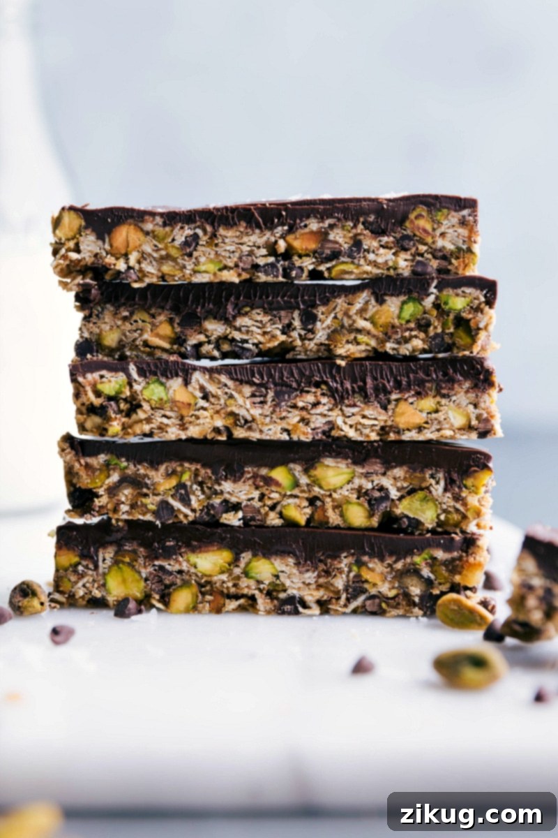Healthy and Delicious Granola Bars: Stacked and Ready to Enjoy A finished granola bar stacked on top of others, showcasing their healthy and delicious interior.