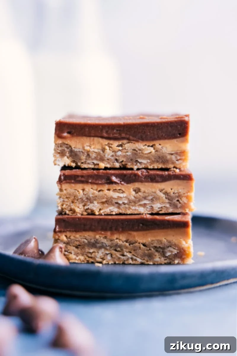 Cafeteria Comfort Peanut Butter Bars 2 Stacked Lunch Lady Peanut Butter Bars with chocolate frosting and peanut butter drizzle