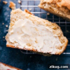 A slice of No-Yeast Bread with butter, showing its dense, moist interior.