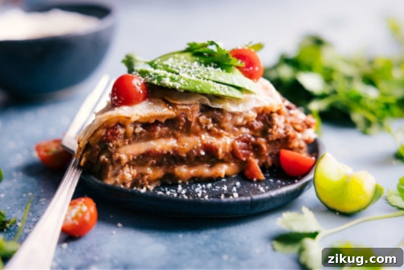 Our family's favorite Tortilla Pie, a delicious and easy layered casserole perfect for any meal. Image of the Tortilla Pie on a plate, ready to be served with toppings