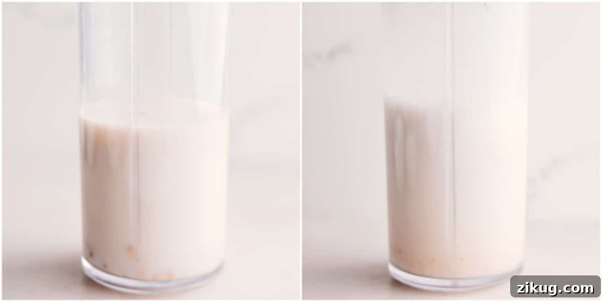 How to Create the Perfect Golden Milk Smoothie: A Step-by-Step Guide for a Refreshing Beverage The initial step of making a Golden Milk Smoothie: Cashews and milk are added to a high-powered blender, ready to be processed into a smooth, creamy base.