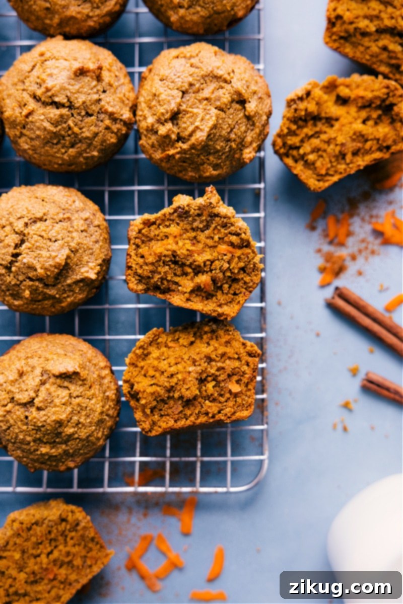 Wholesome Spiced Carrot Muffins 3 A close-up of a stack of healthy carrot muffins on a cooling rack, showing their texture and inviting appearance.