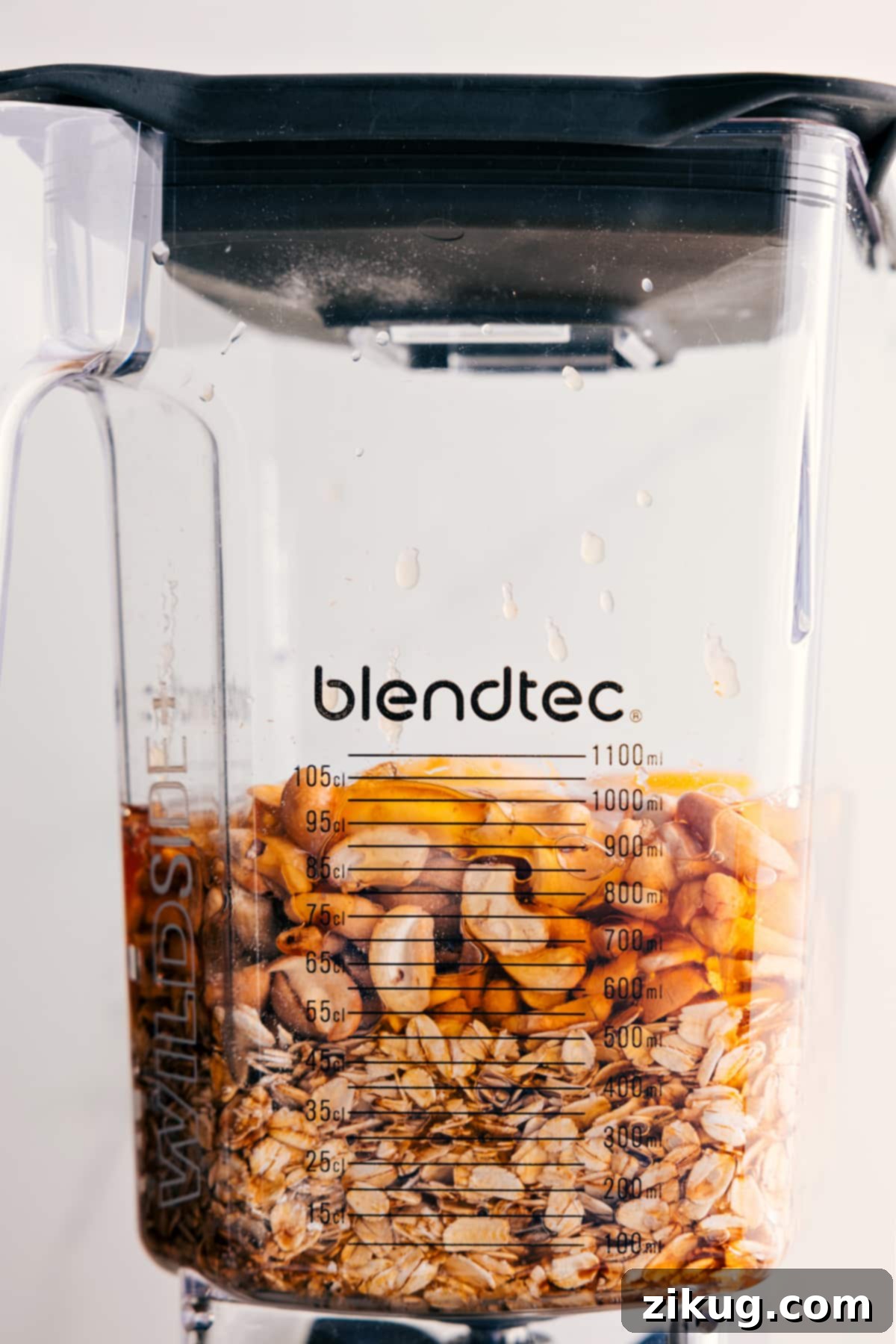 Add all the ingredients for the healthy apple cake to a blender for this easy blender cake recipe.
