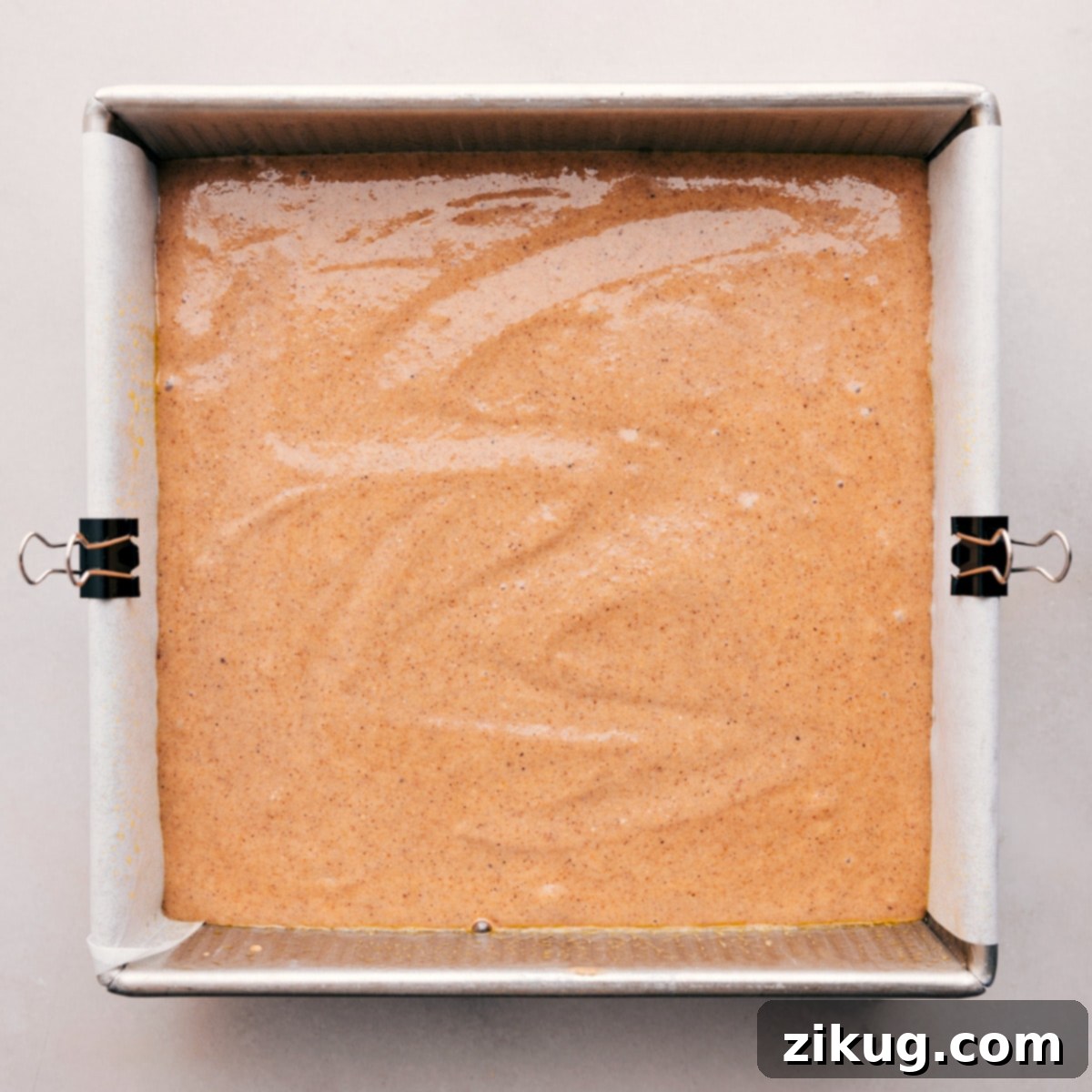 Spread the batter into a prepared pan to bake, illustrating the simple baking process.
