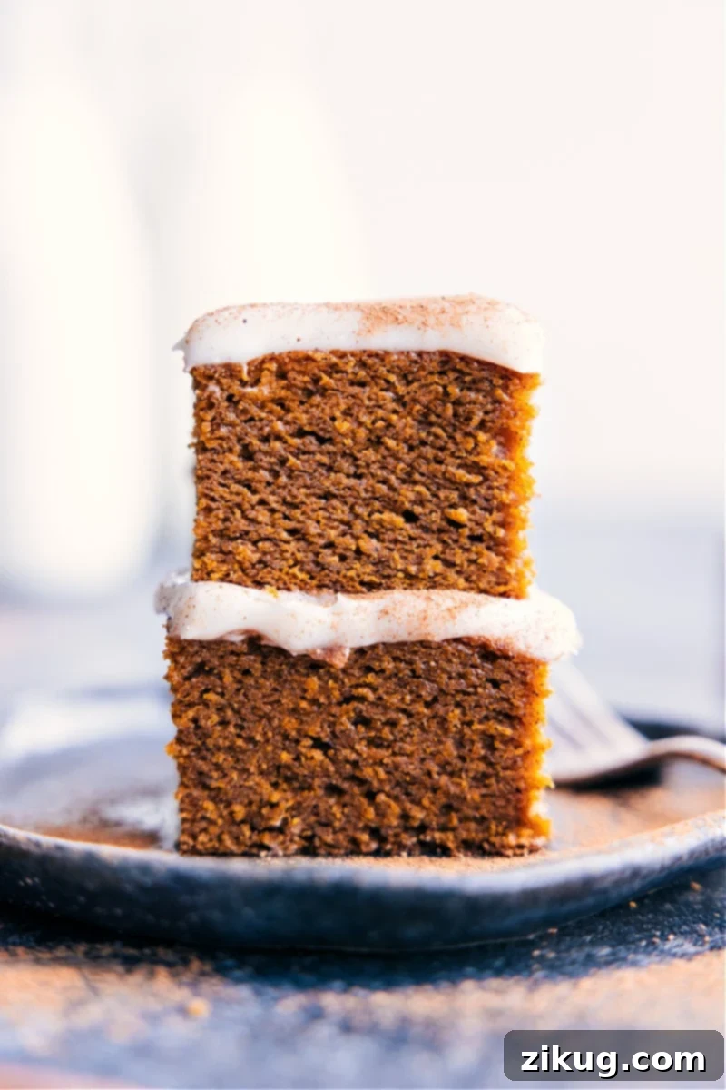 Delicious Healthy Pumpkin Cake: Gluten-Free, Dairy-Free, Refined Sugar-Free Stacked slices of moist, healthy pumpkin cake topped with a light dusting of pumpkin pie spice.