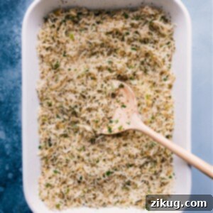 Delicious Baked Lemon Rice with fresh parsley and lemon slices.