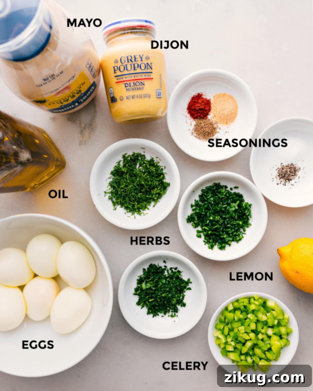 Ingredients In Egg Salad Recipe All the vibrant ingredients prepped and arranged for effortless assembly, showcasing fresh mayonnaise, zesty Dijon mustard, aromatic seasonings, fragrant herbs, a touch of olive oil, perfectly steamed eggs, bright lemon, and crisp celery, ready to be transformed into a delectable egg salad.