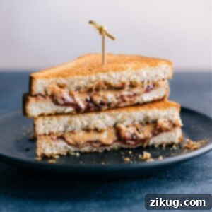 Air Fryer Sandwiches Four Creative Ways 2 An air fryer sandwich, sliced in half, showing the golden-brown bread and gooey filling.